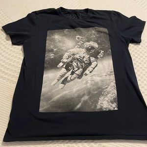 Rebels & Nomads black short sleeve tshirt with astronaut on the front. Size med